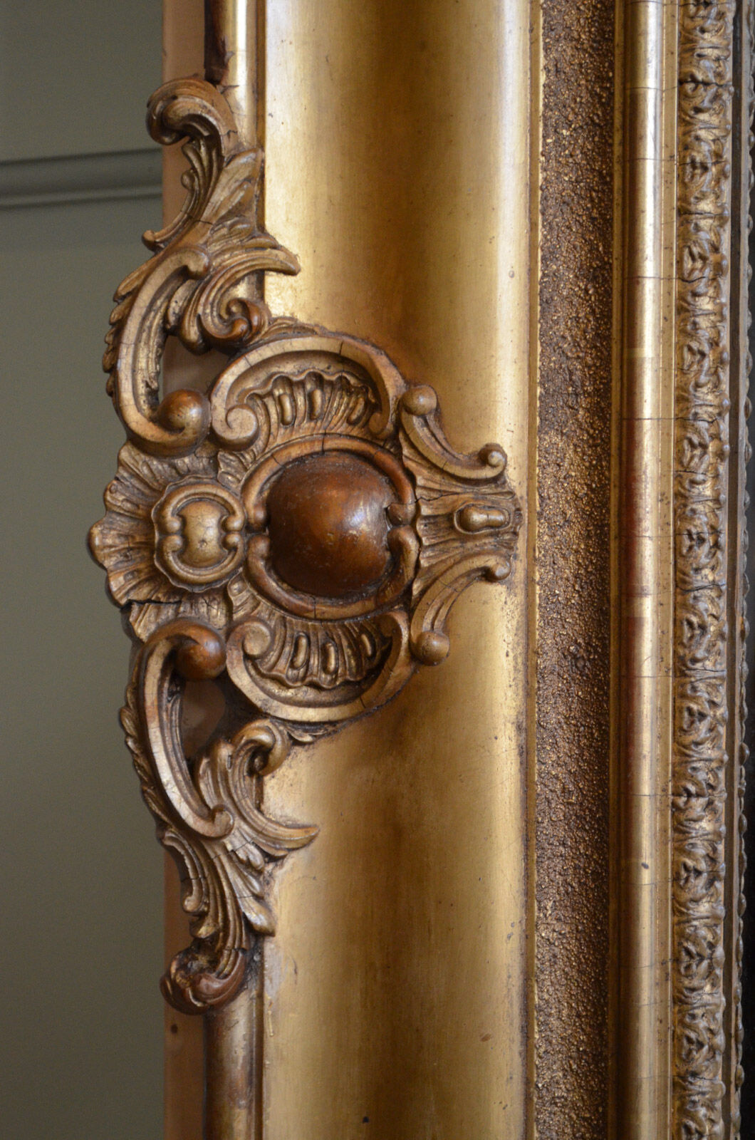 Nineteenth century monumental mirror in gilded wood