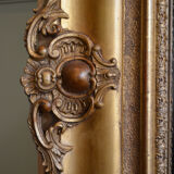 Nineteenth century monumental mirror in gilded wood