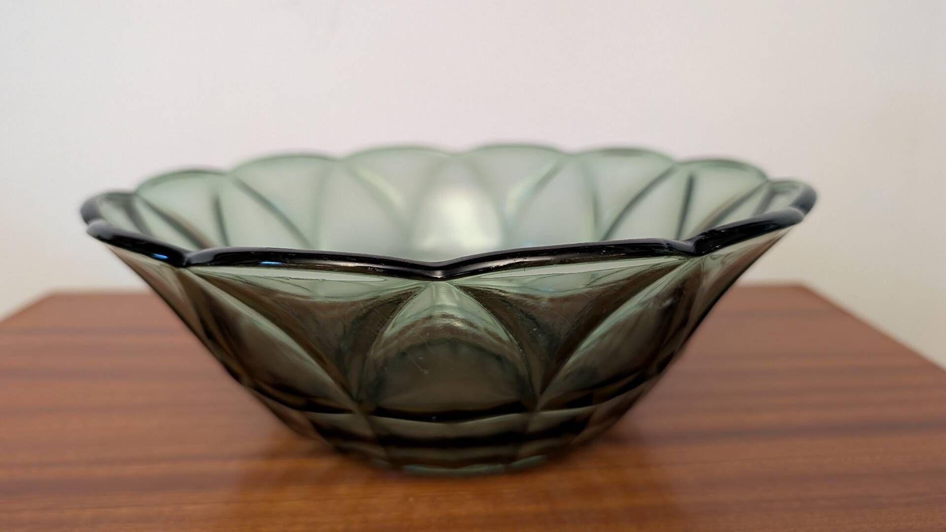 Vintage green smoked glass coupe with geometric decoration.