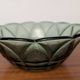 Vintage green smoked glass coupe with geometric decoration.