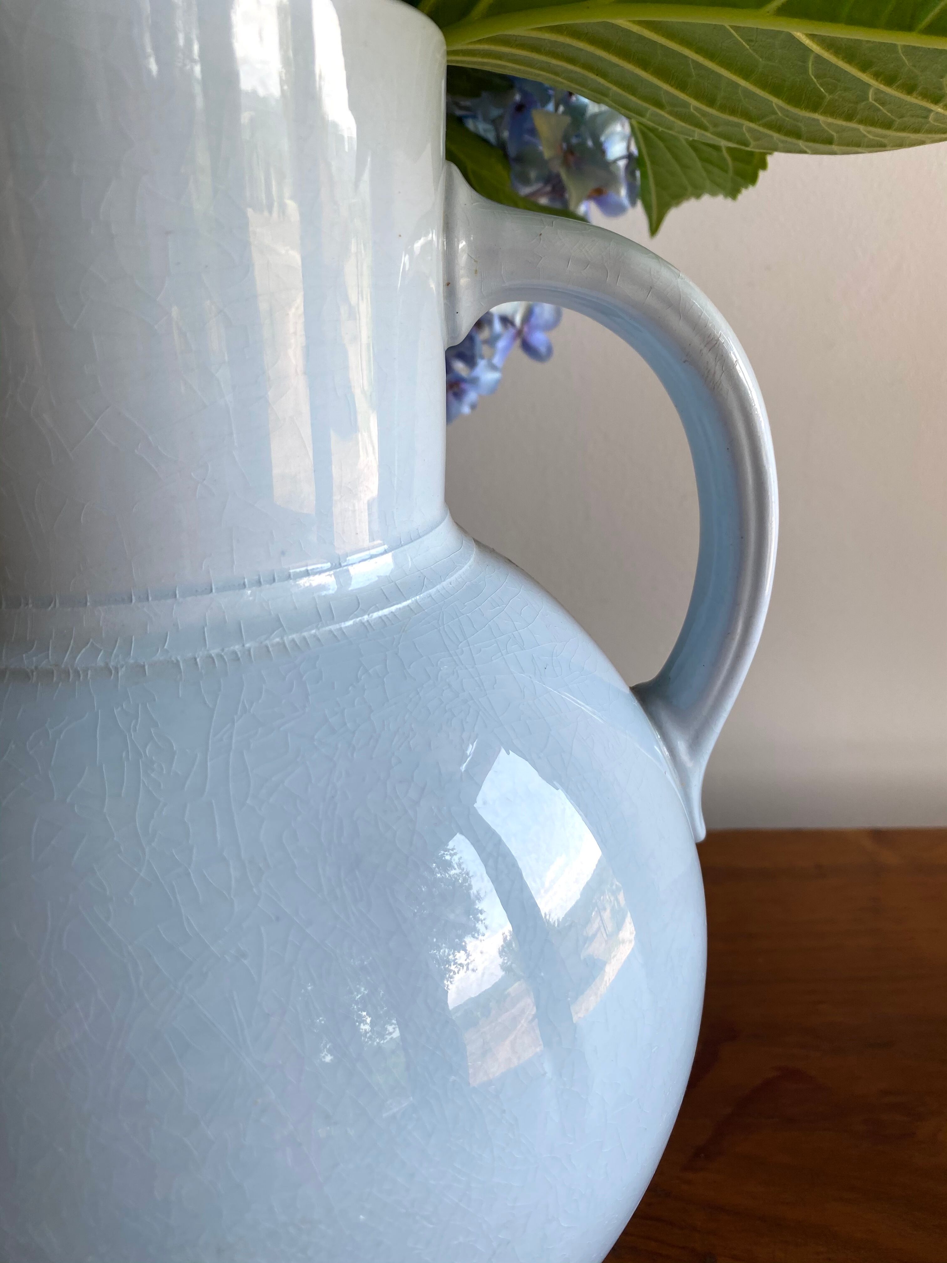 Antique vase in pale blue ceramic