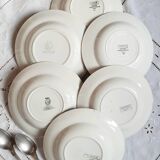 Mismatched old soup plates accompanied by a soup tureen