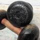 Pair of vintage cast iron and wood dumbbells