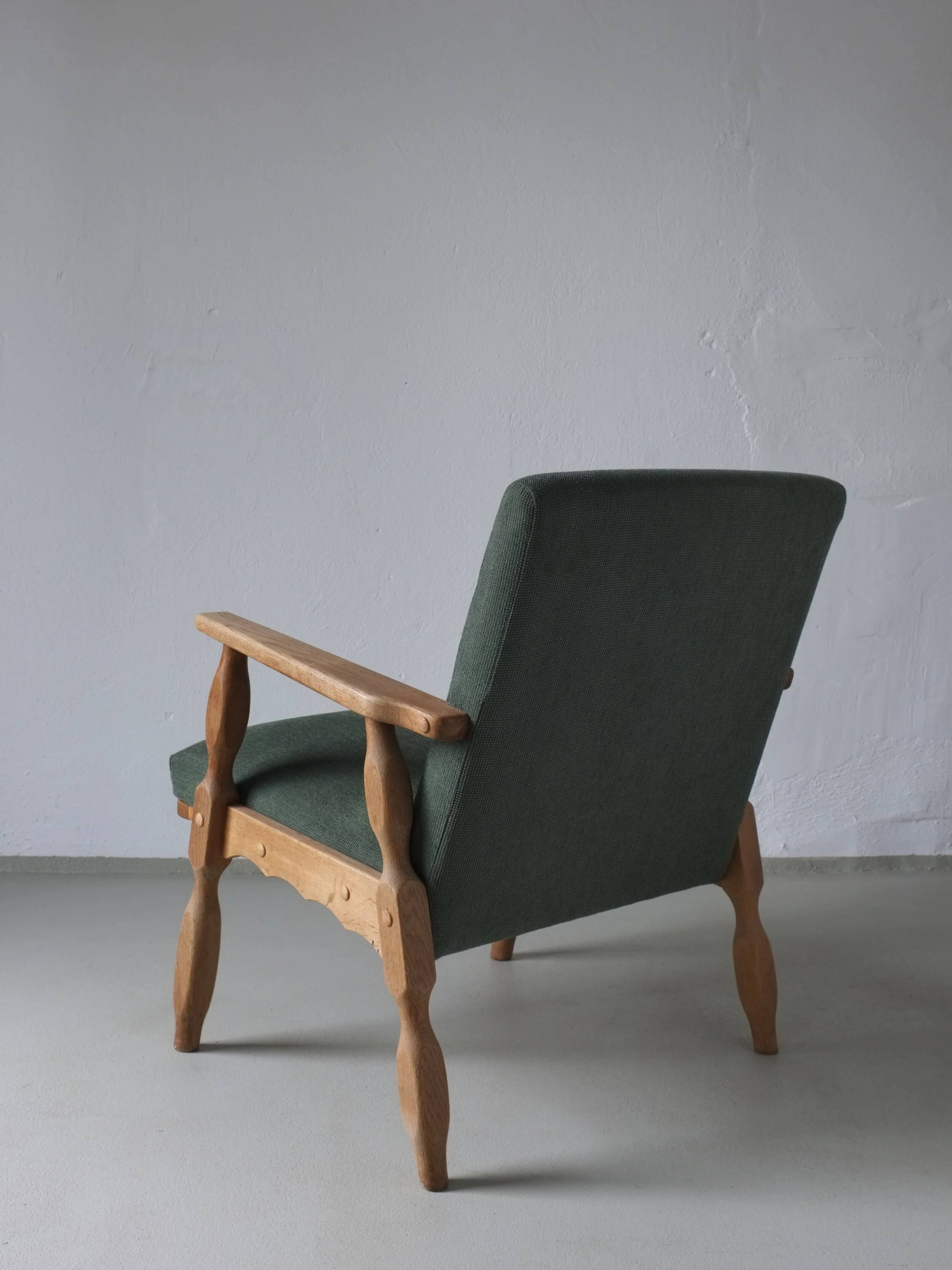 Henning Kjaernulf oak scalloped lounge chair | Denmark | 1950s