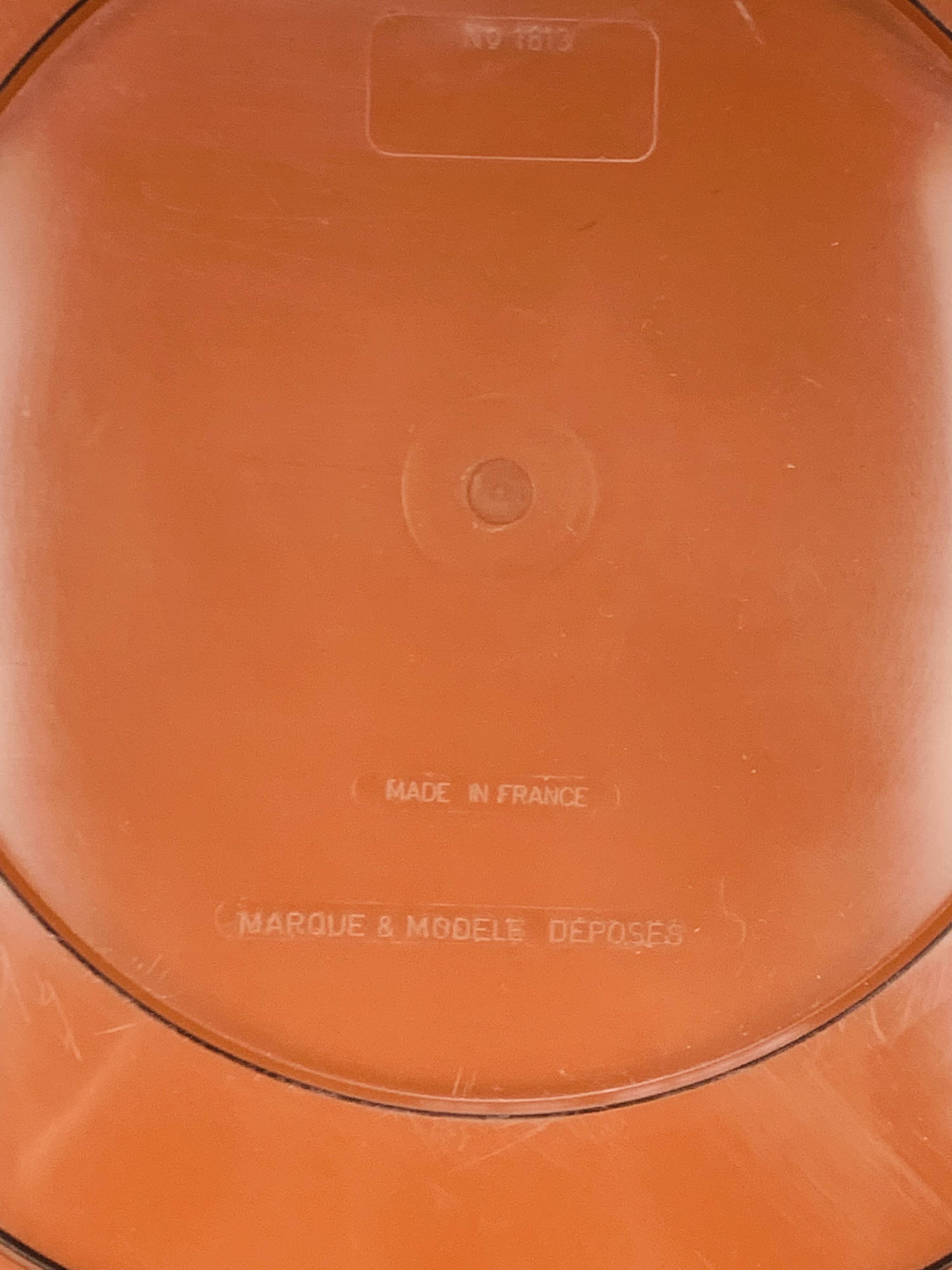 Round mirror with amber rim from the 70s, vintage