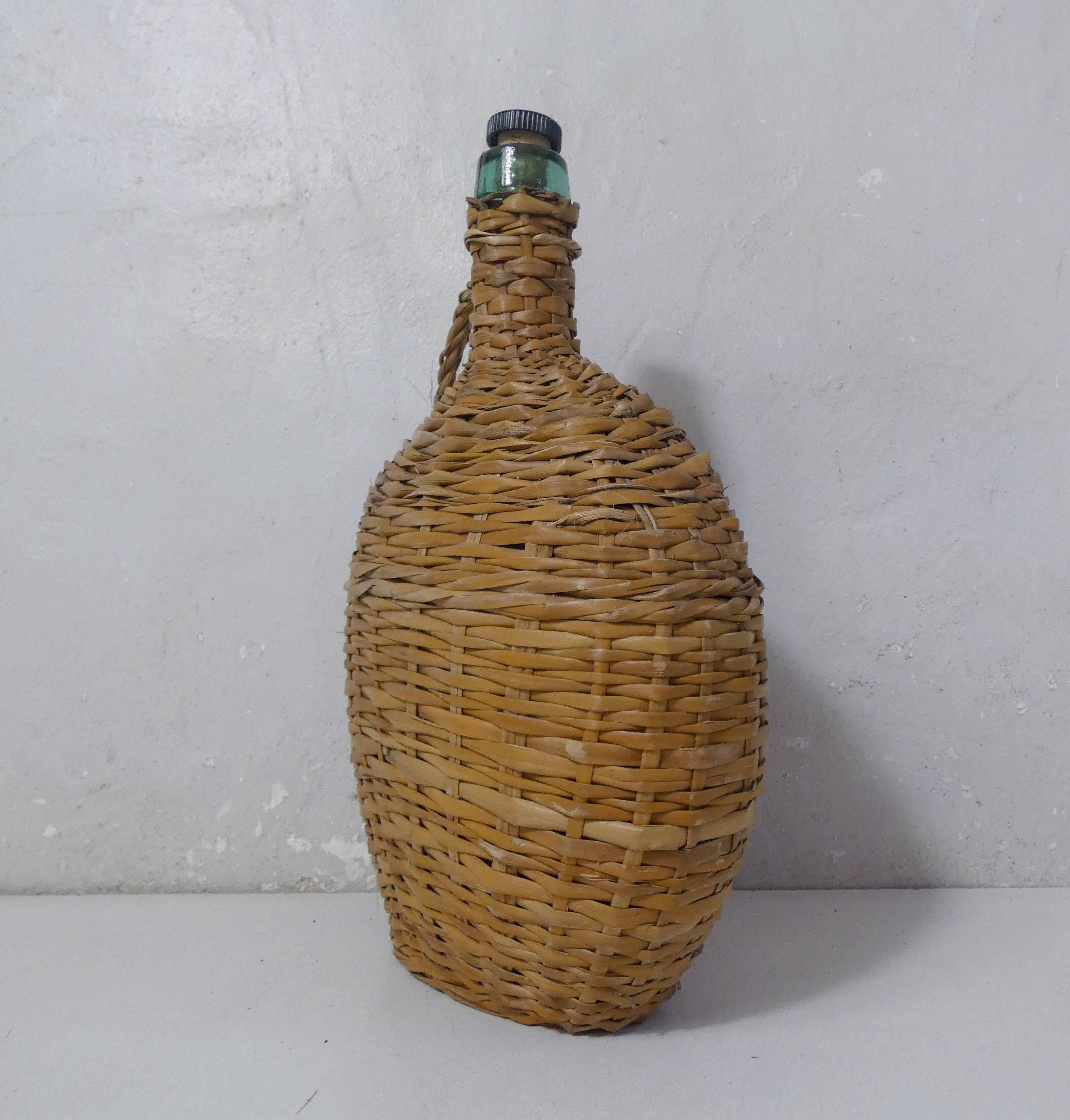 old bottle dressed in rattan vintage pilgrim gourd