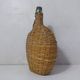 old bottle dressed in rattan vintage pilgrim gourd