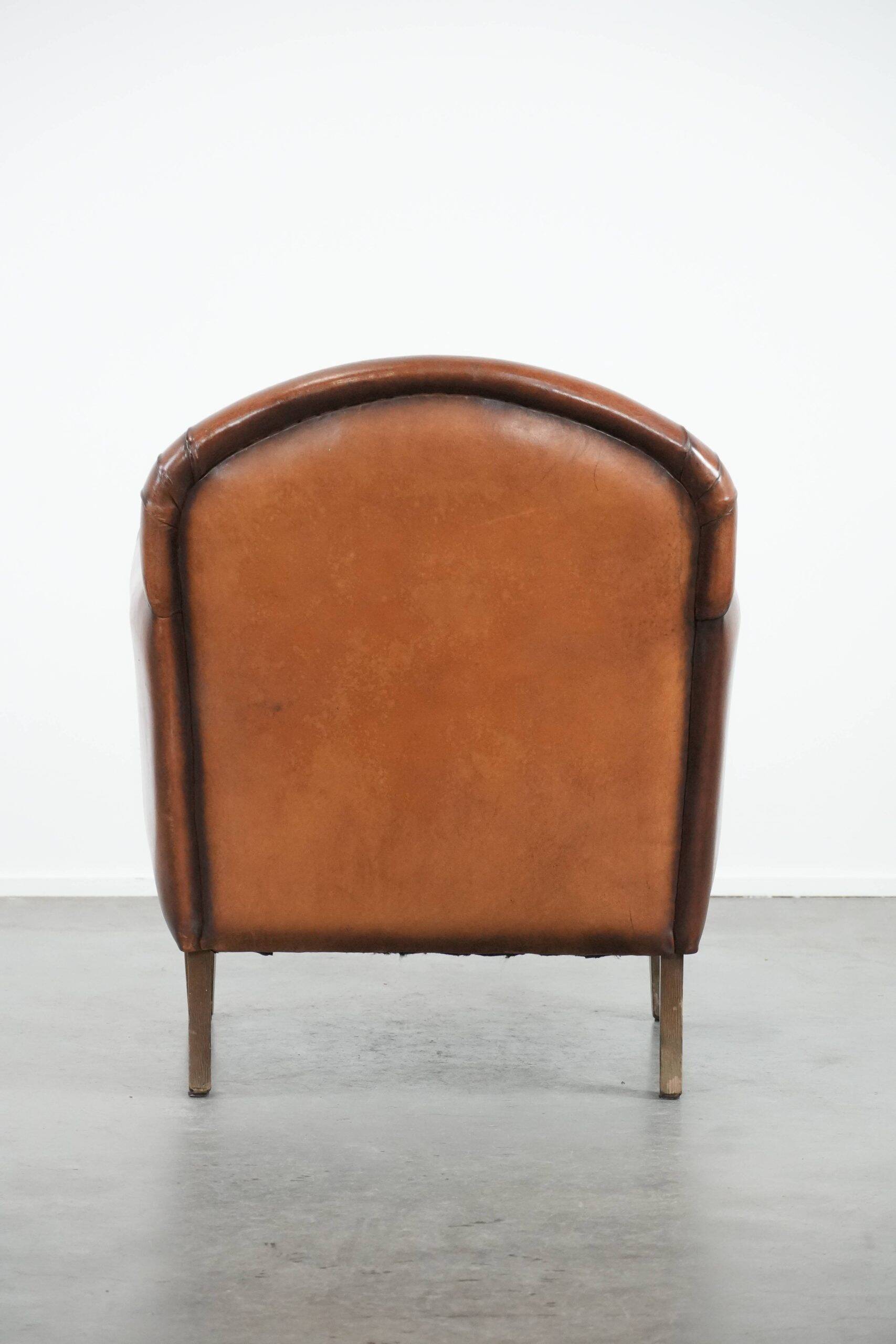 Armchair made of sheepskin leather in art deco design with warm colours