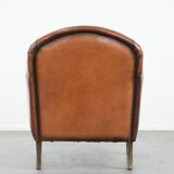 Armchair made of sheepskin leather in art deco design with warm colours