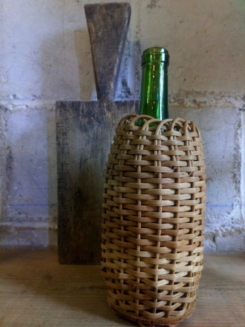 Bottle in a rattan basketry 50s