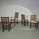 Ensemble de 4 chaises de salle à manger en chêne, rustiques, de ferme, à dossier en échelle avec sièges en jonc, années 1960