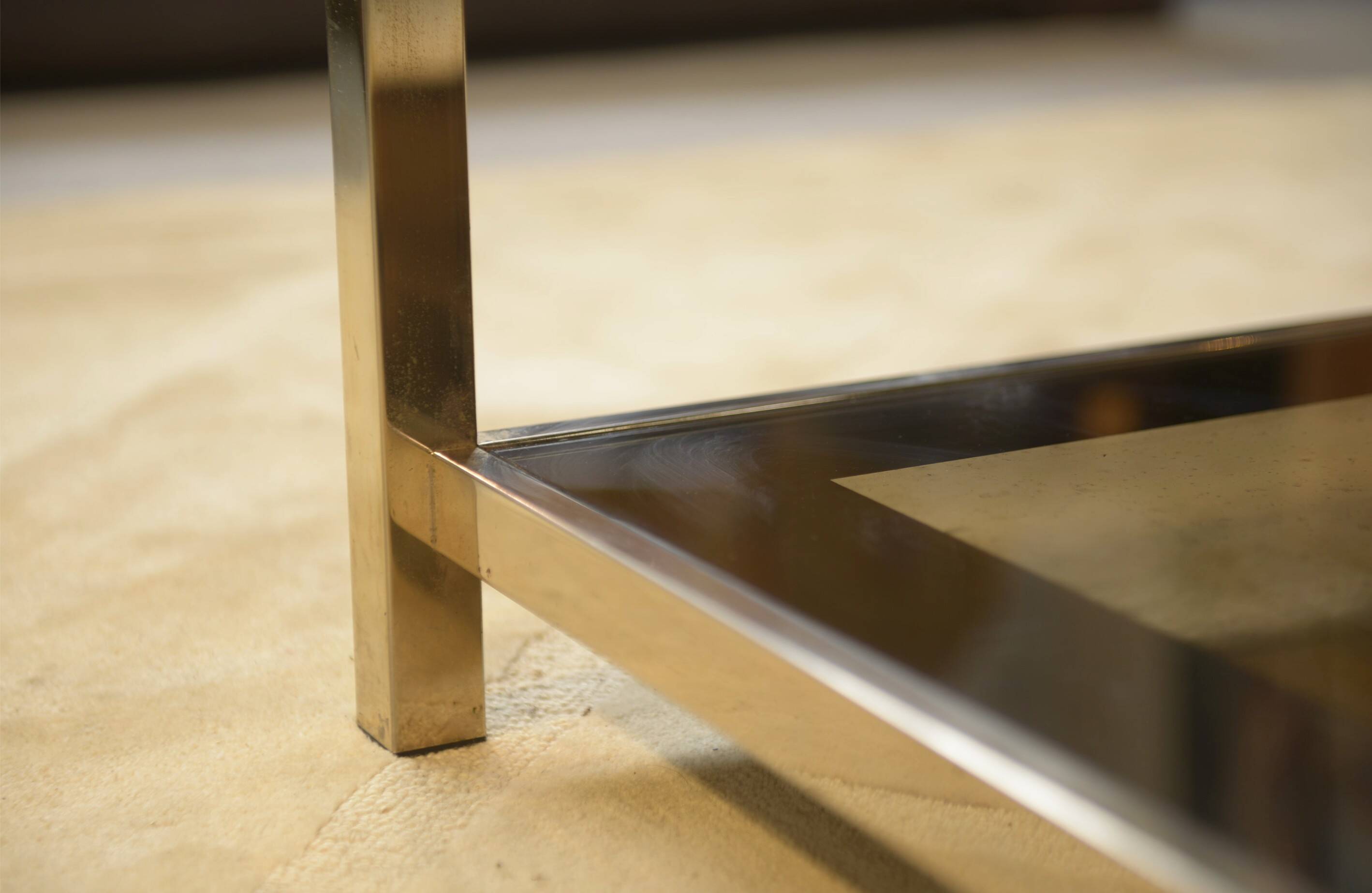 Hollywood Regency coffee table in smoked glass with mirrored framing from the 1970s.