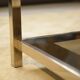 Hollywood Regency coffee table in smoked glass with mirrored framing from the 1970s.