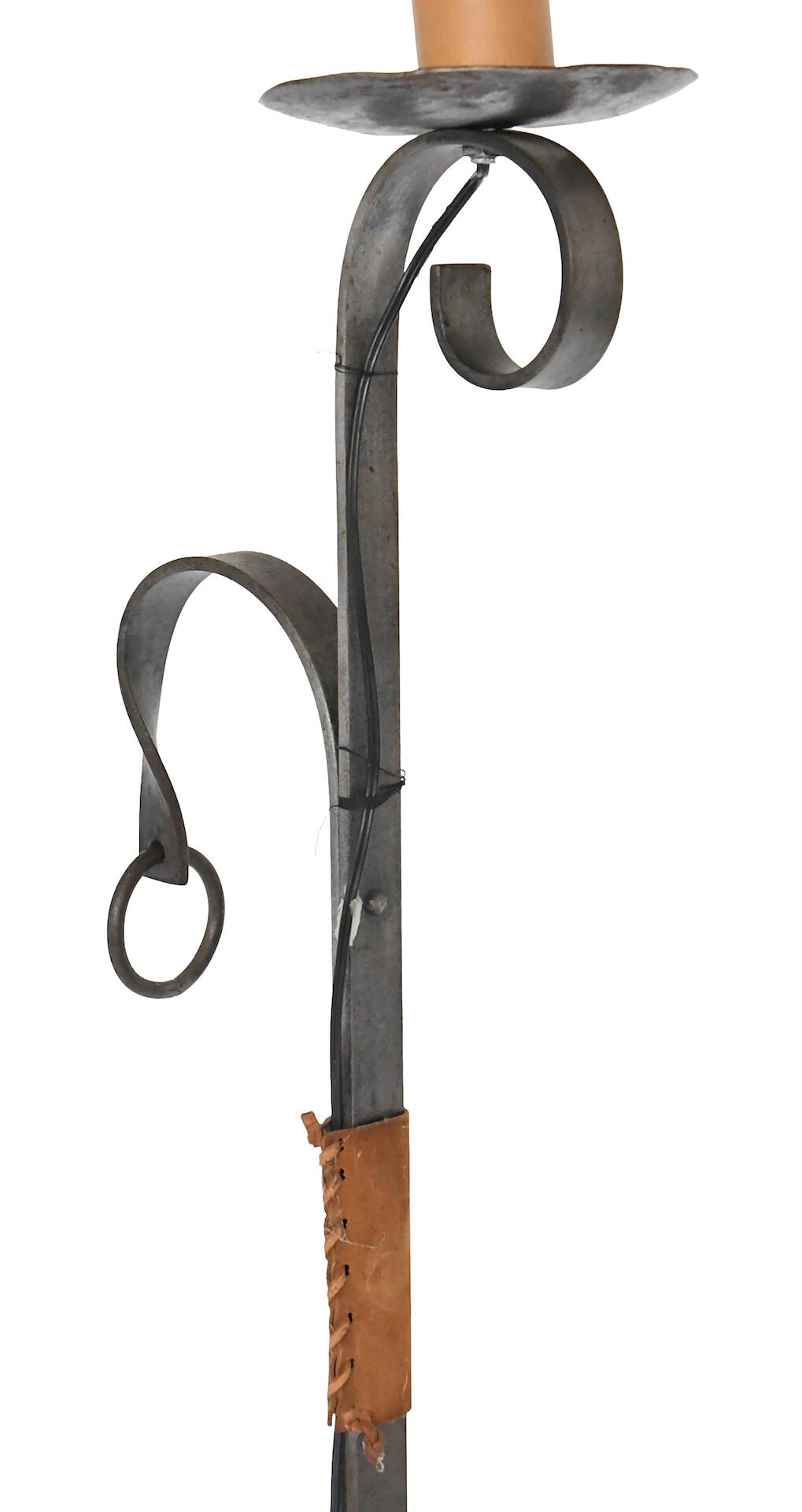 Wrought iron and leather floor lamp in the style of Jean-Pierre Ryckaert.