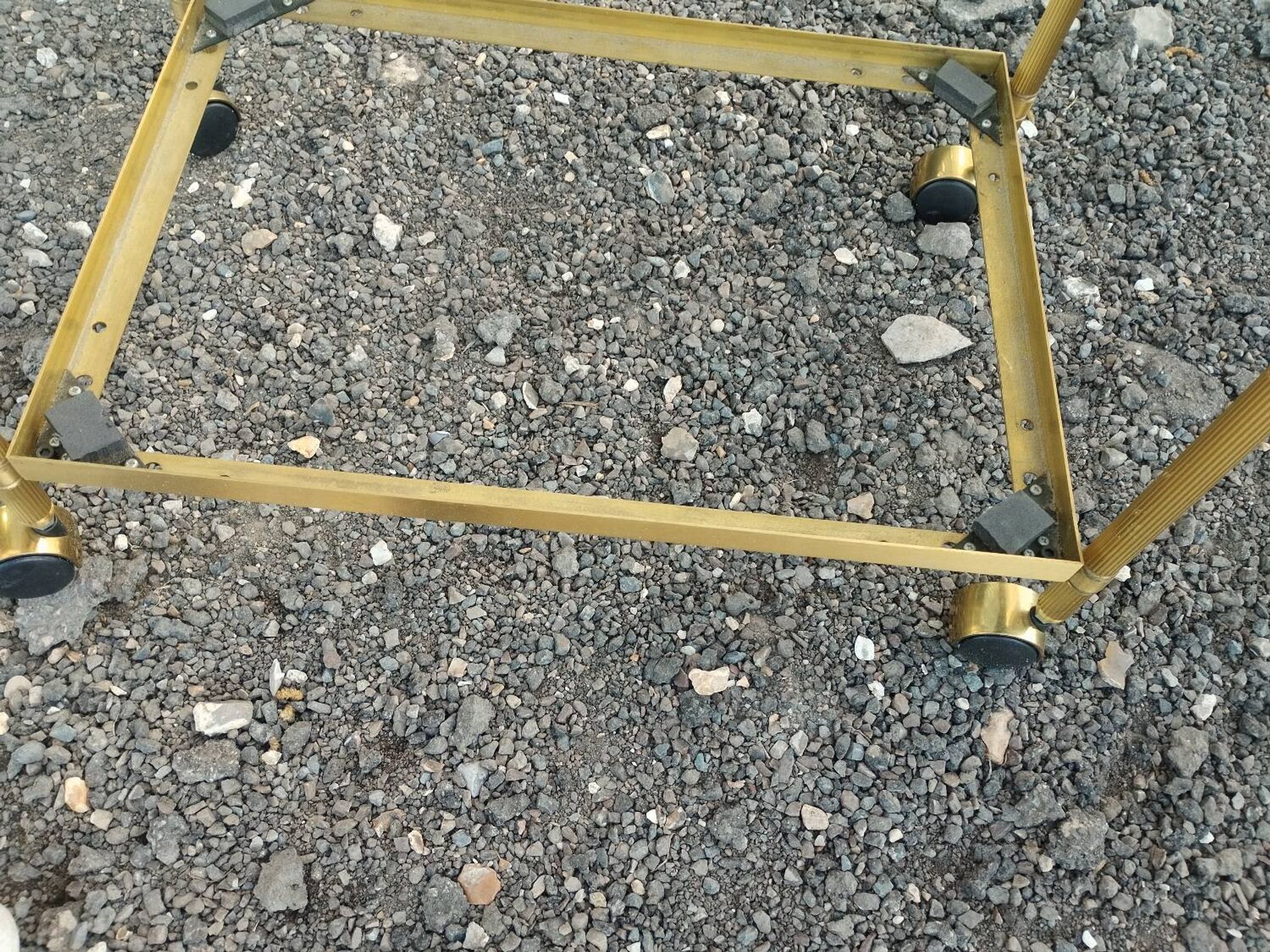 Vintage golden metal rolling dessert trolley