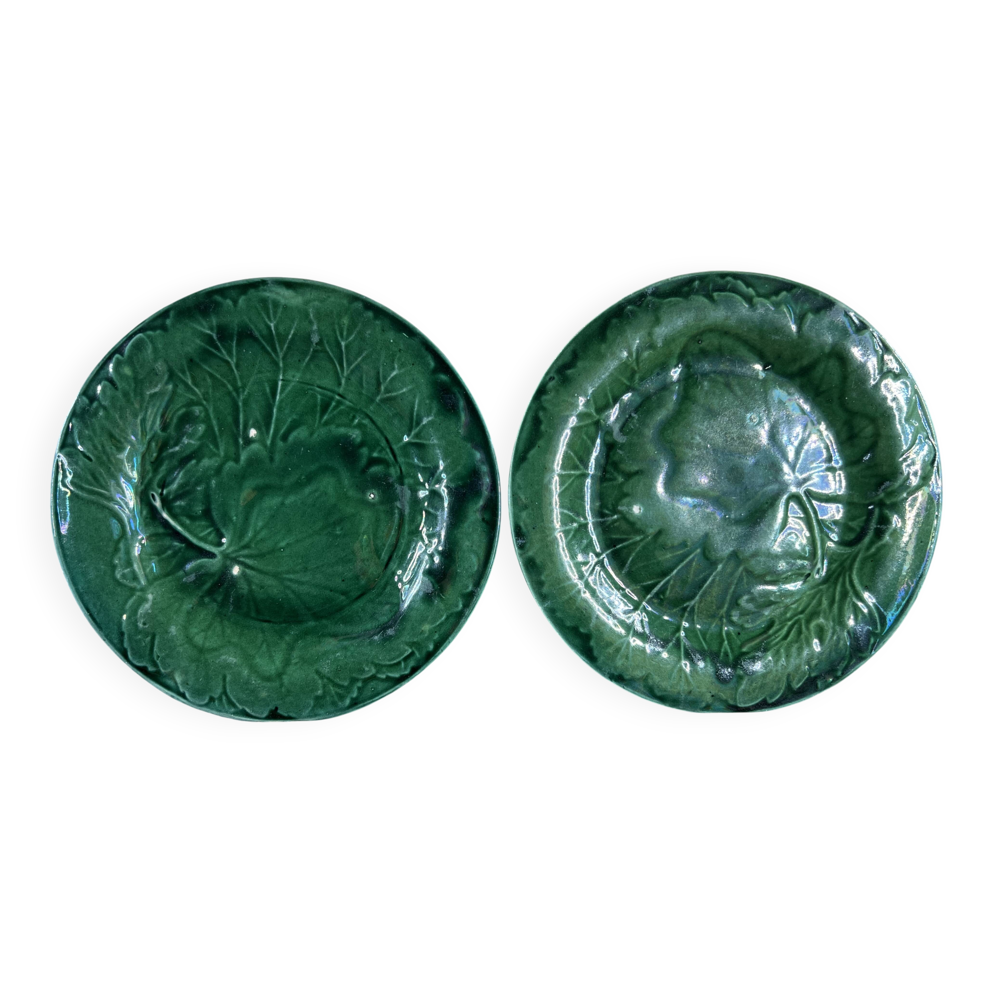 Pair of green slip plates with leaf decoration, 19th century