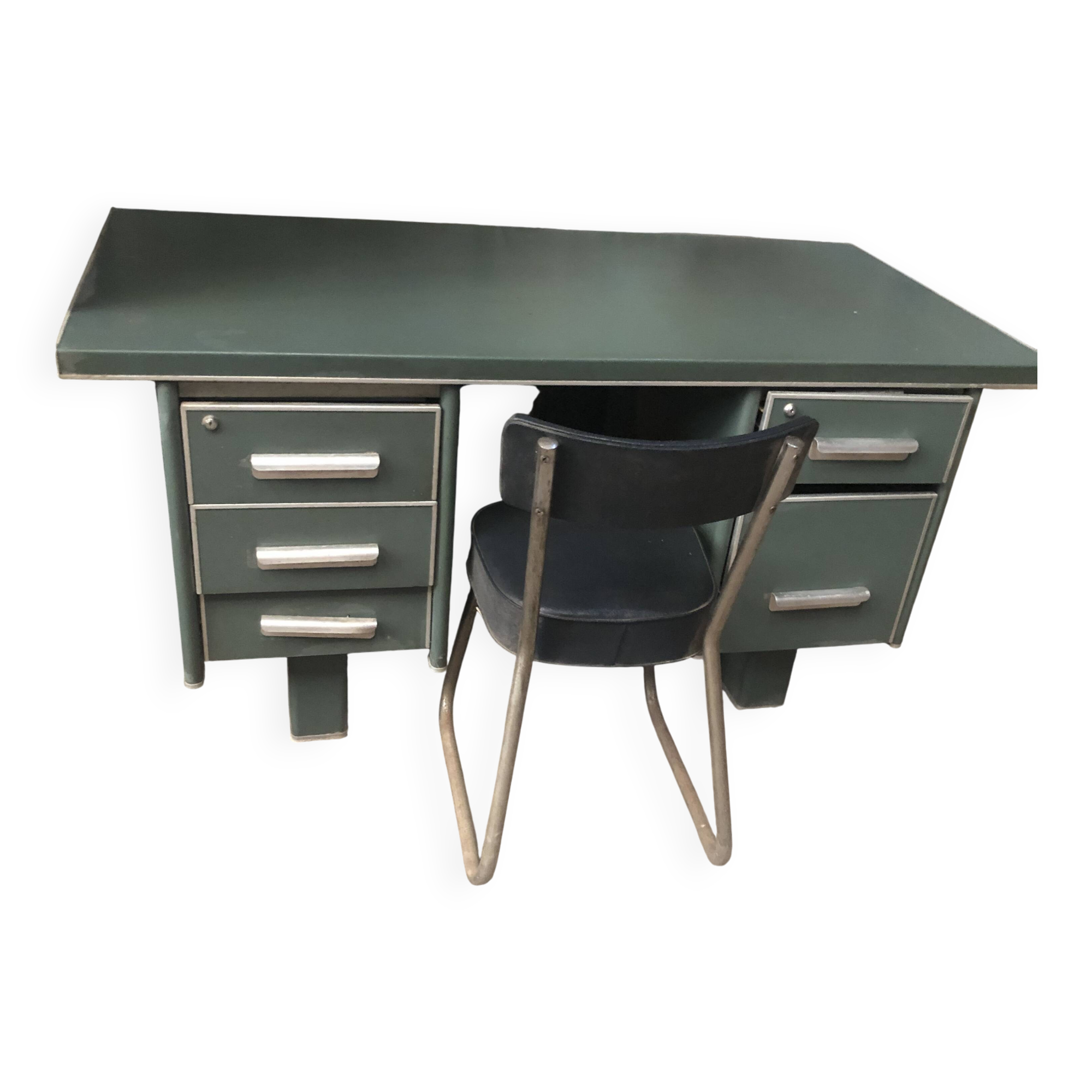 Old metal desk with chair