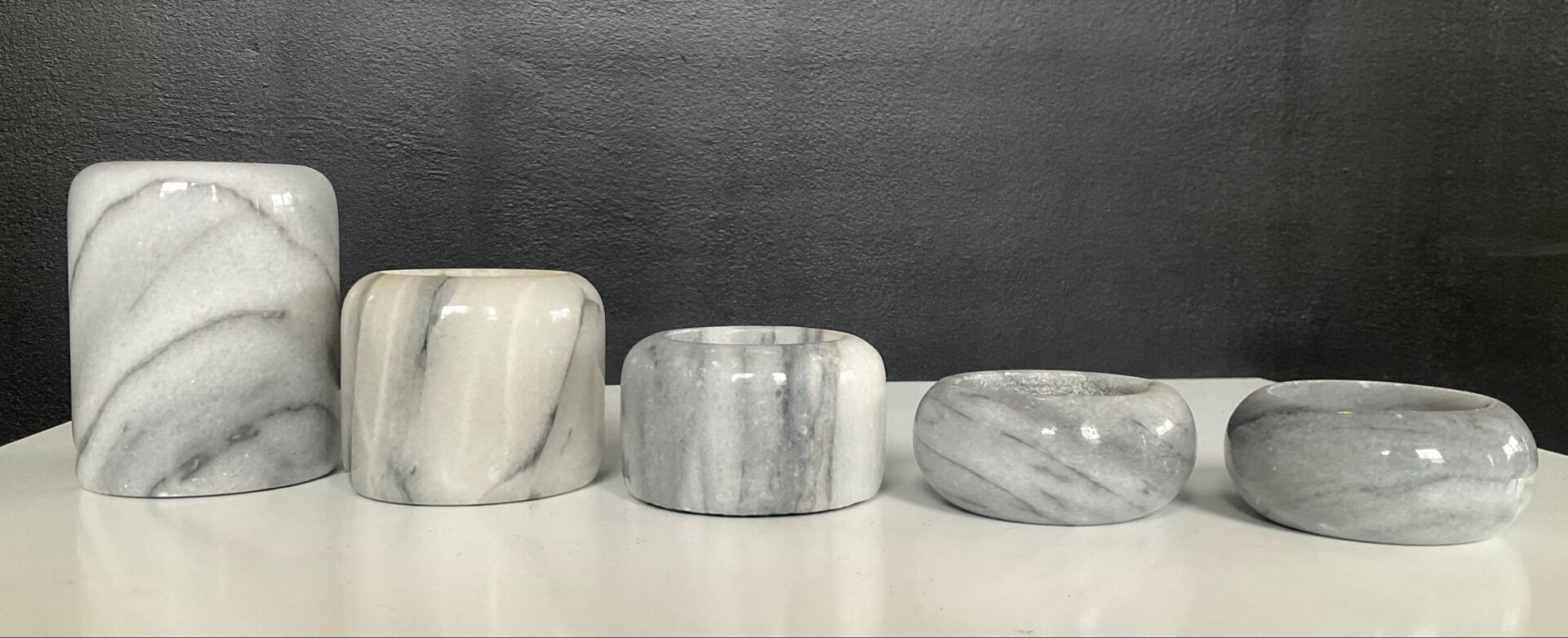 Set of 5 nesting candle holders in white marble.