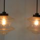 Set of two glass pendant lighting designed by Raak Holland