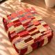 Vintage Moroccan pouf in multicoloured handmade wool.