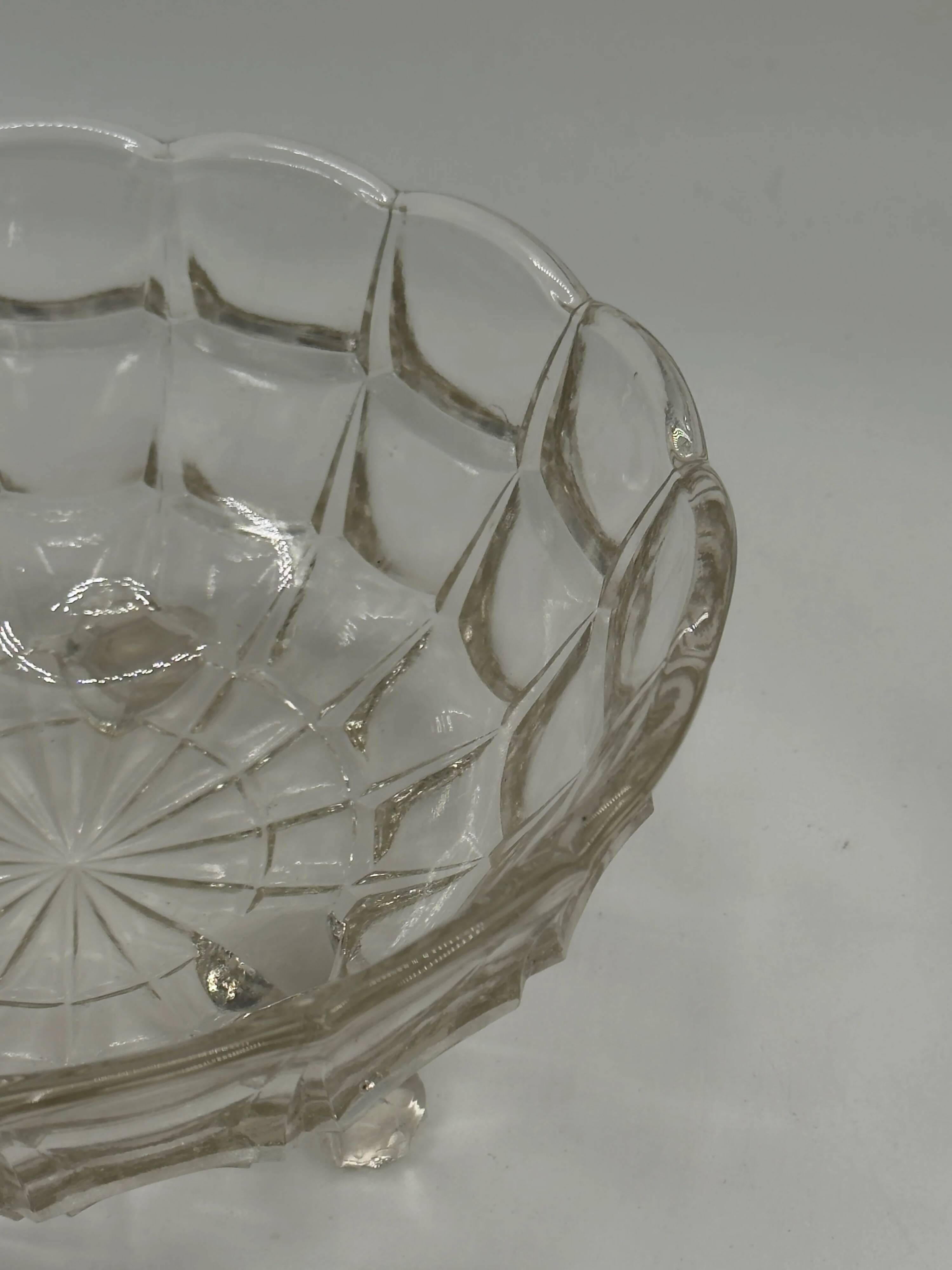 Vintage pressed glass footed coupe with scalloped diamond-cut edge.