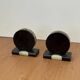 Vintage pair of bookends in fossilised coral agate | Stone disc-shaped bookends on a black marble base
