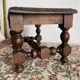 Low stool in carved wood