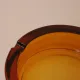 Vintage Italian round ashtray in thick amber glass – Ø 15 cm