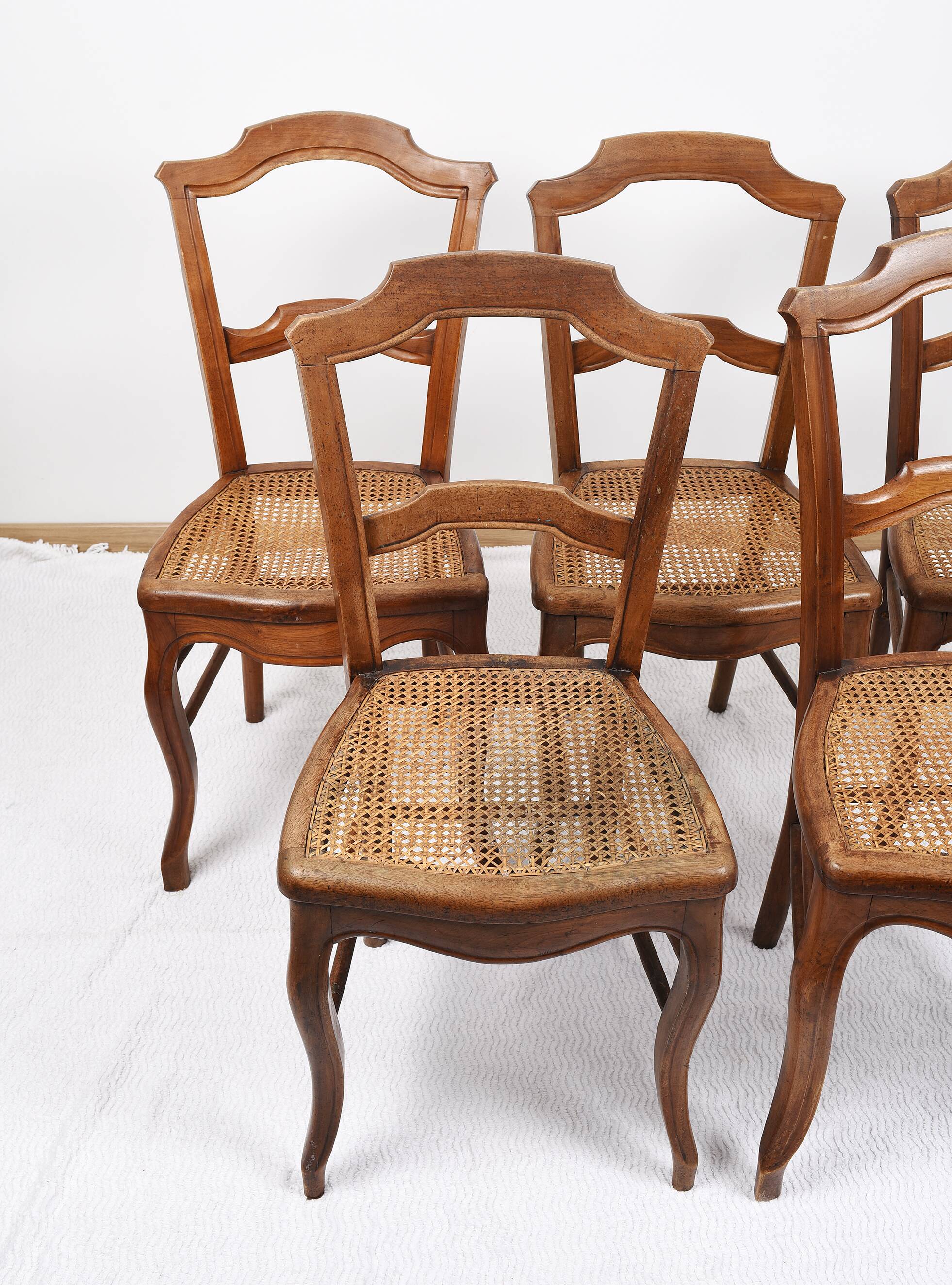 Set of 5 old cane chairs.