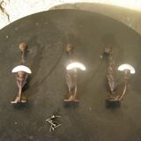 Trio of vintage coat hooks.