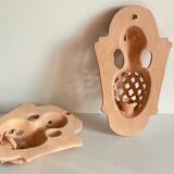 Pair of terracotta wall candle holders
