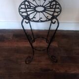 Black wrought iron support for plants
