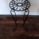Black wrought iron support for plants