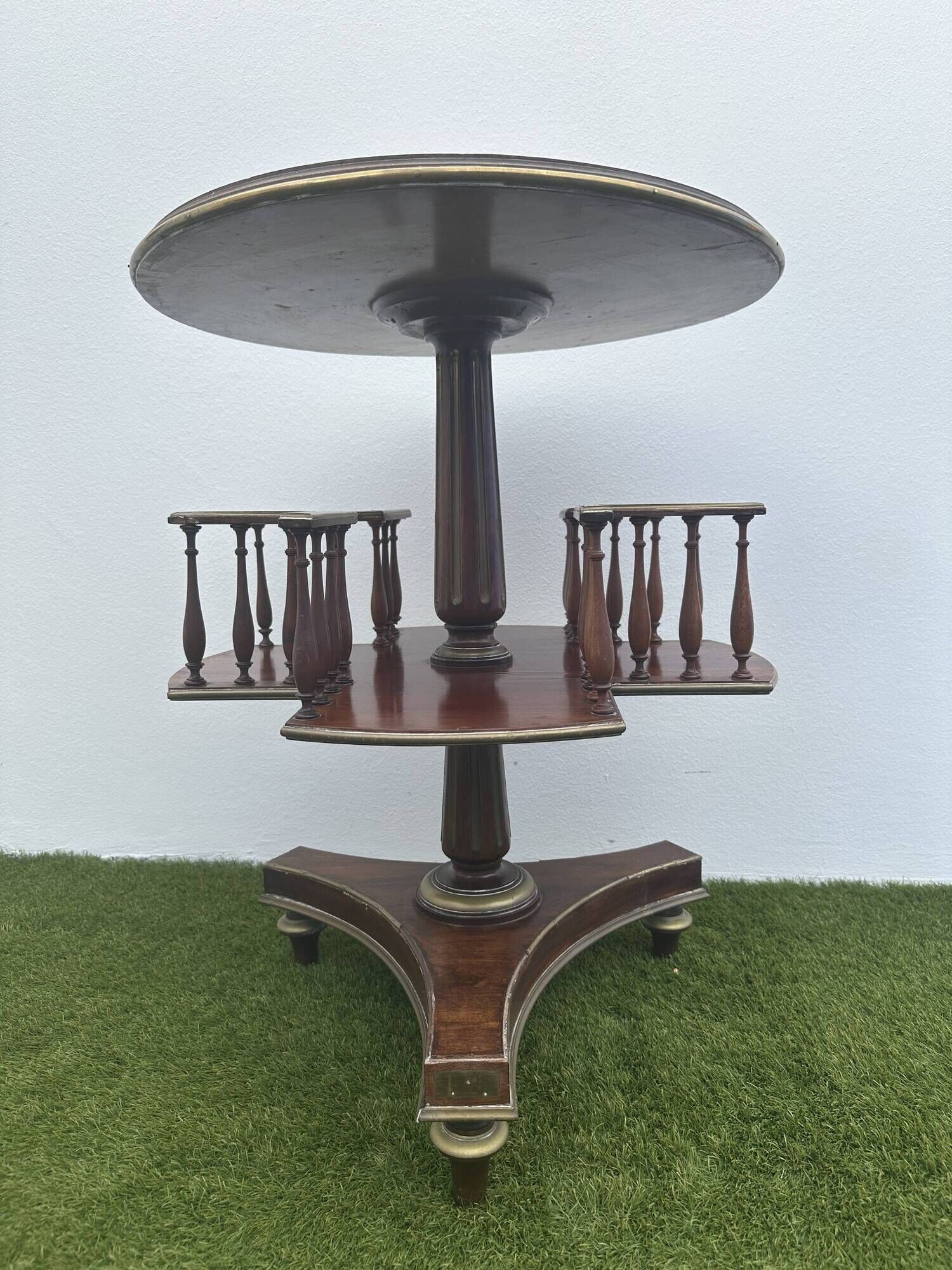Old round and revolving wooden and brass library