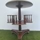 Old round and revolving wooden and brass library