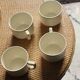 4 cups in ecru and gold Sarreguemines earthenware
