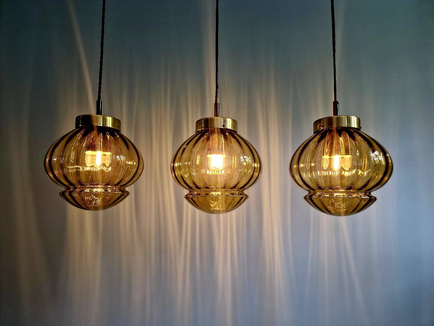 Set of 3 amber glass pendant lights, RAAK Amsterdam, 1970