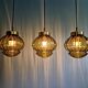 Set of 3 amber glass pendant lights, RAAK Amsterdam, 1970