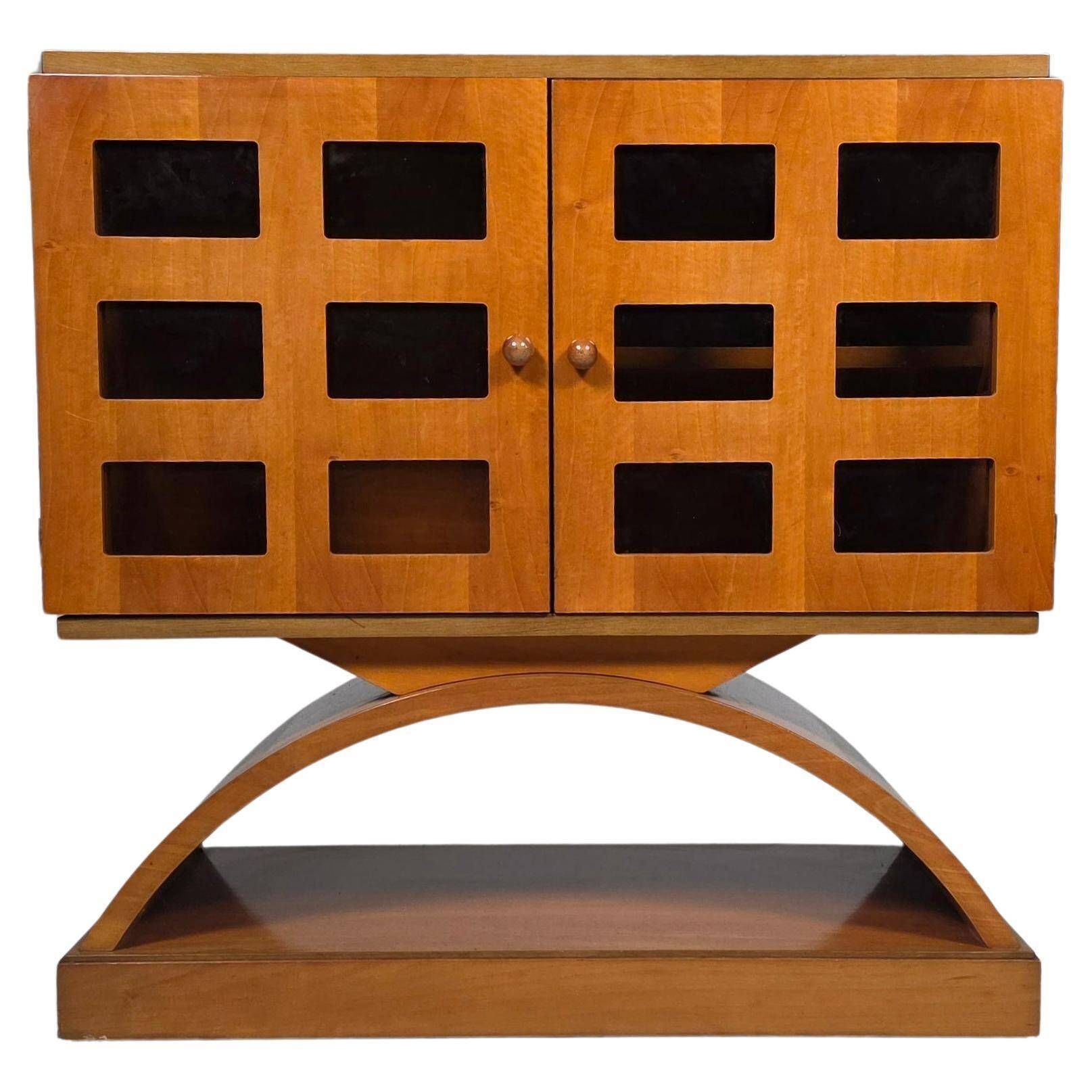 Mid-century modern mobile bar cabinet with sculptural base, 1950s.