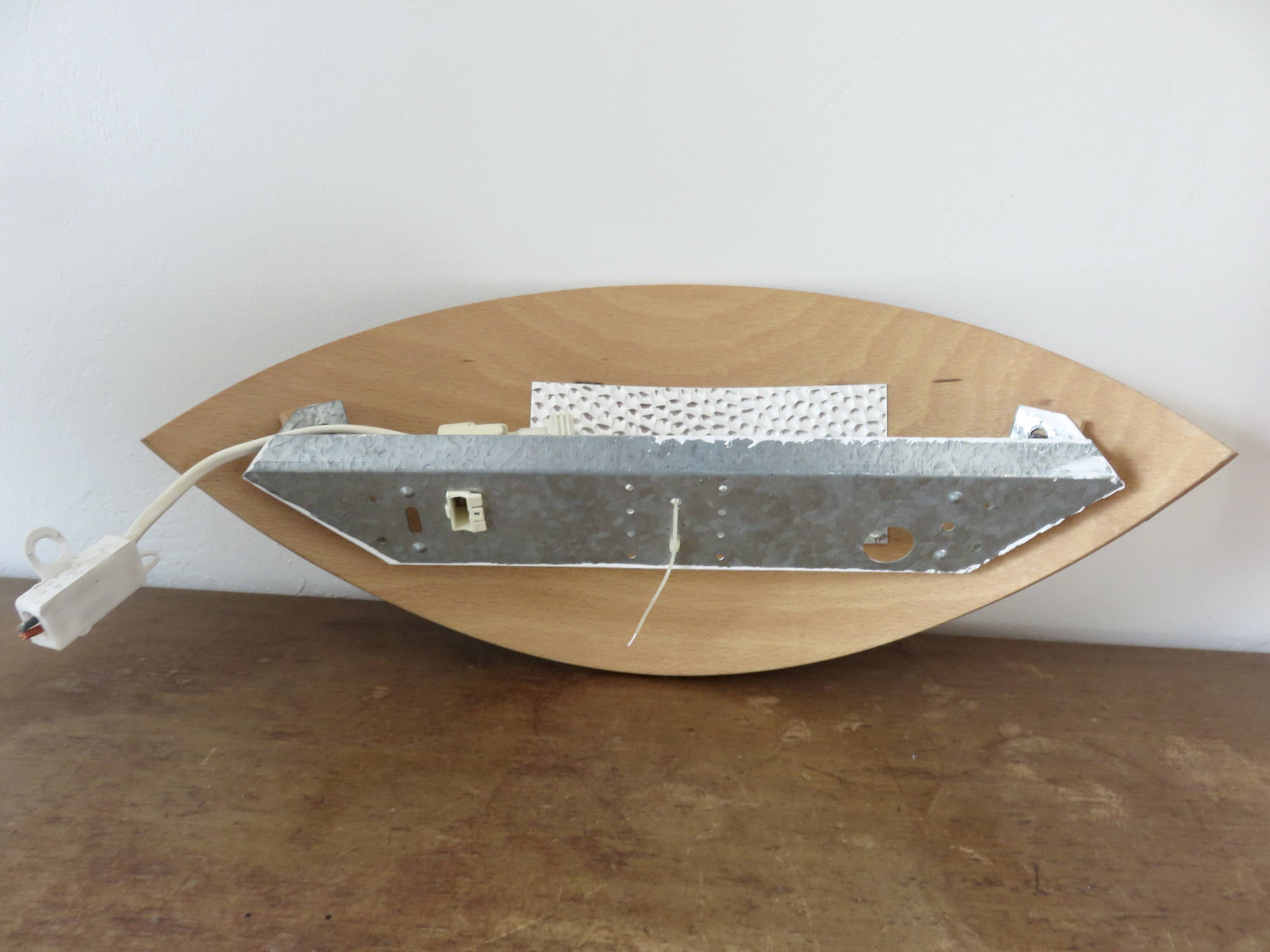 Pair of Scandinavian wall lights in bent wood with brass accents, 1980.