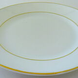 Suite of twelve table plates in white and gold porcelain.