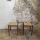 Pair of 20th-century wooden stools with straw seats