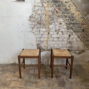 Pair of 20th-century wooden stools with straw seats
