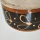 Vintage dish with black and ochre decoration and a speckled crackled interior – 1970s