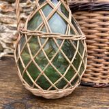 Glass bottles and rattan, woven wicker