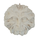 Bas relief sun in plaster