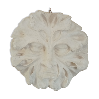 Bas relief sun in plaster