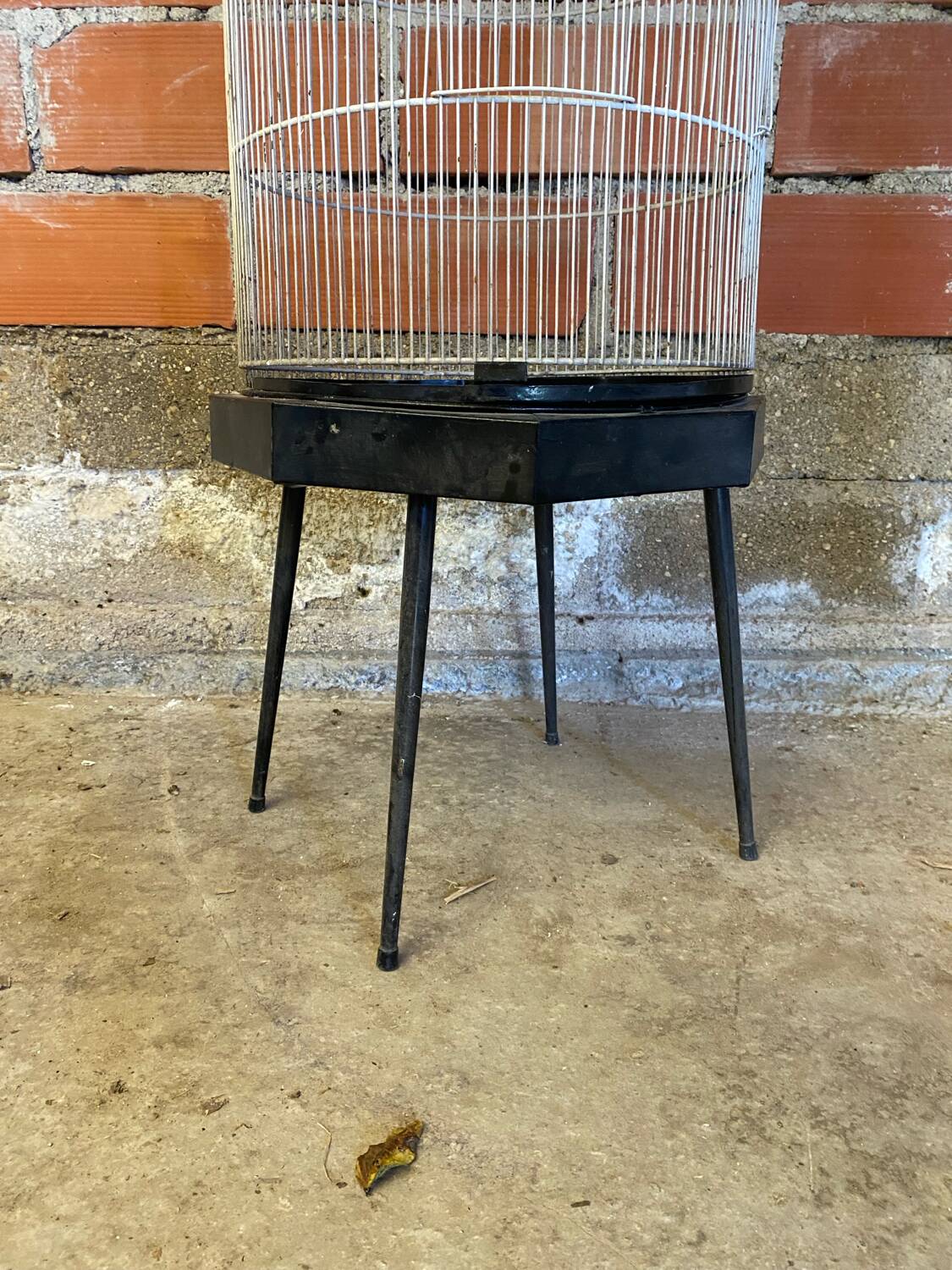 Antique black & white metal bird cage on vintage decorative legs