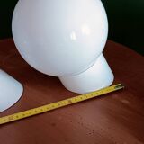 Two opaline glass globe wall lights