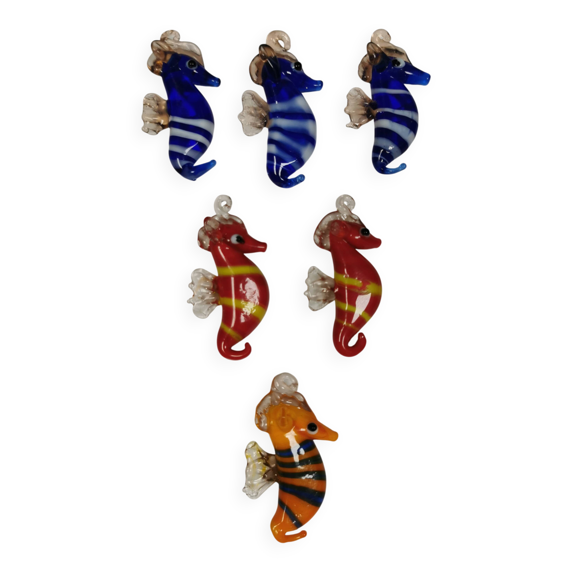 Six small Murano Seahorses in glass.